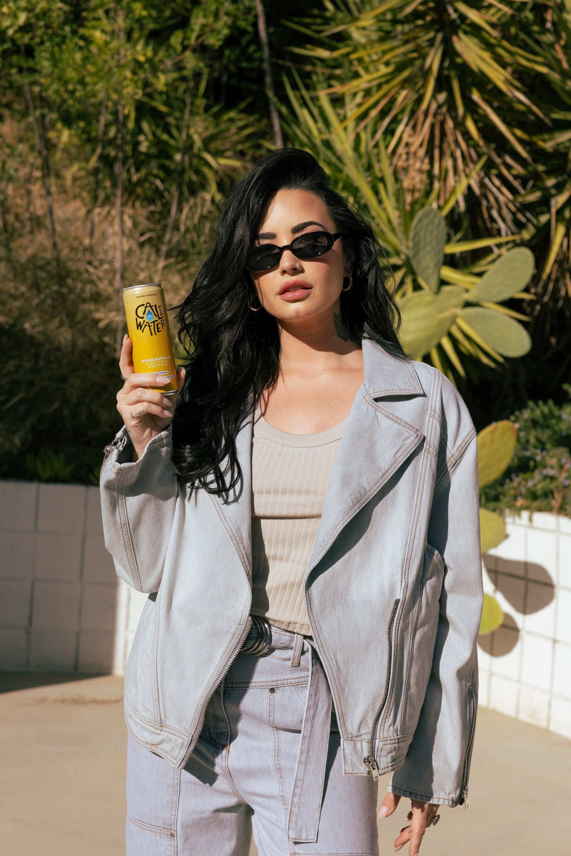 Demi Lovato holding Caliwater